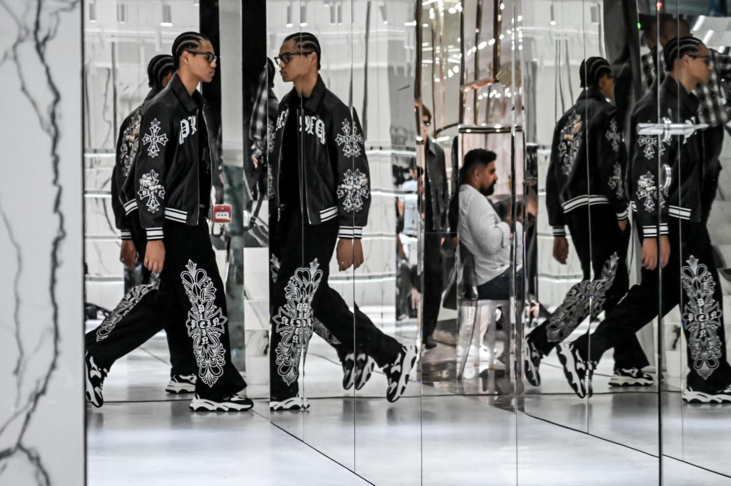Prada preached restraint for a world in chaos—then Milan filled its summer runways with leather and knits nobody can actually wear in the heat