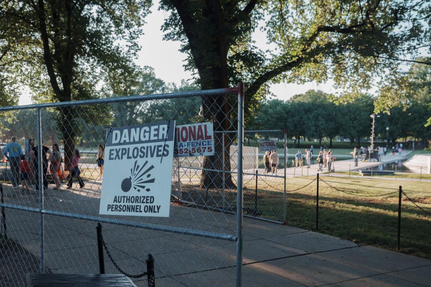 White House blames ‘leftist activists’ for Reflecting Pool snafus as crews put up fencing to block off the algae- and peeling paint-filled water