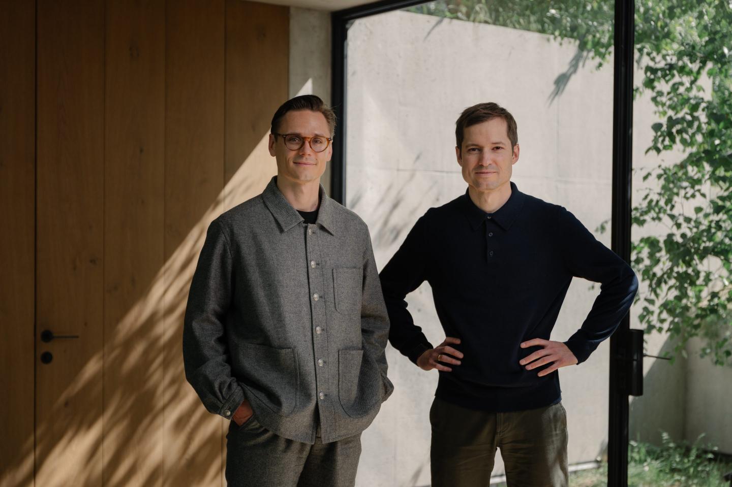 Taktile cofounders Maik Taro Wehmeyer (left) and Maximilian Eber (right) stand side by side, smiling at the camera.