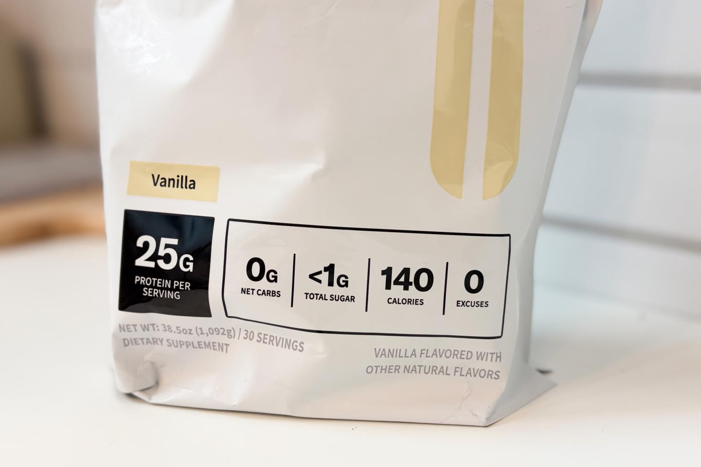 A close-up of a a bag of NOBULL Plant Protein. It displays the grams of protein, sugar, net carbs, and calories.