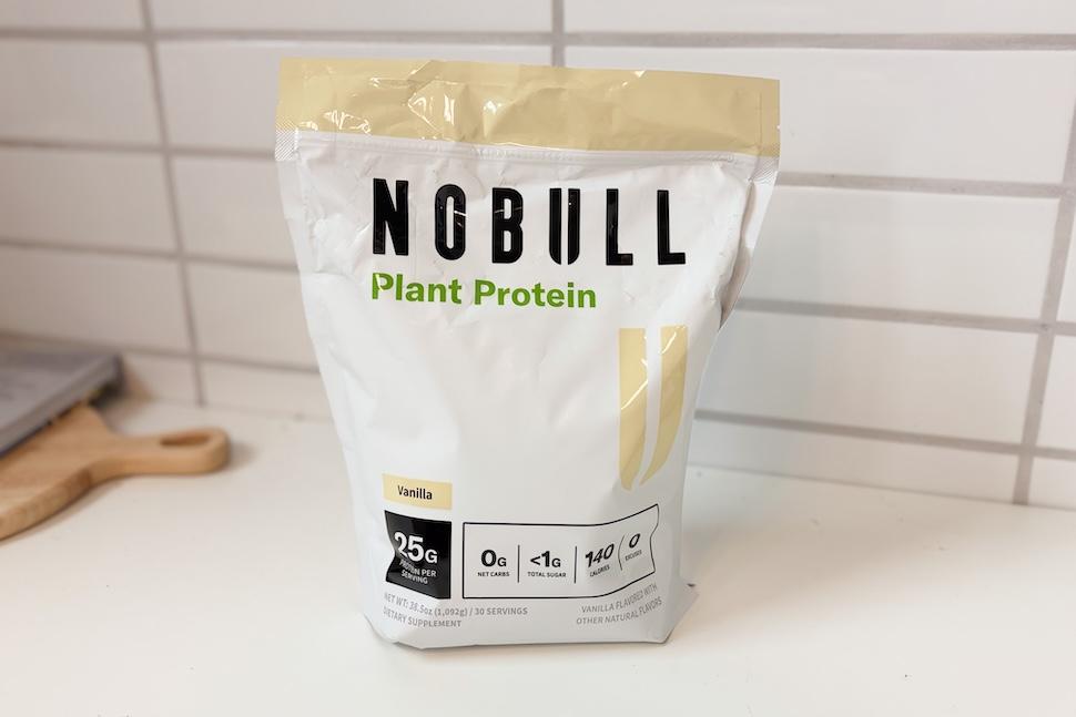 A bag of NOBULL Plant Protein sitting on a white countertop