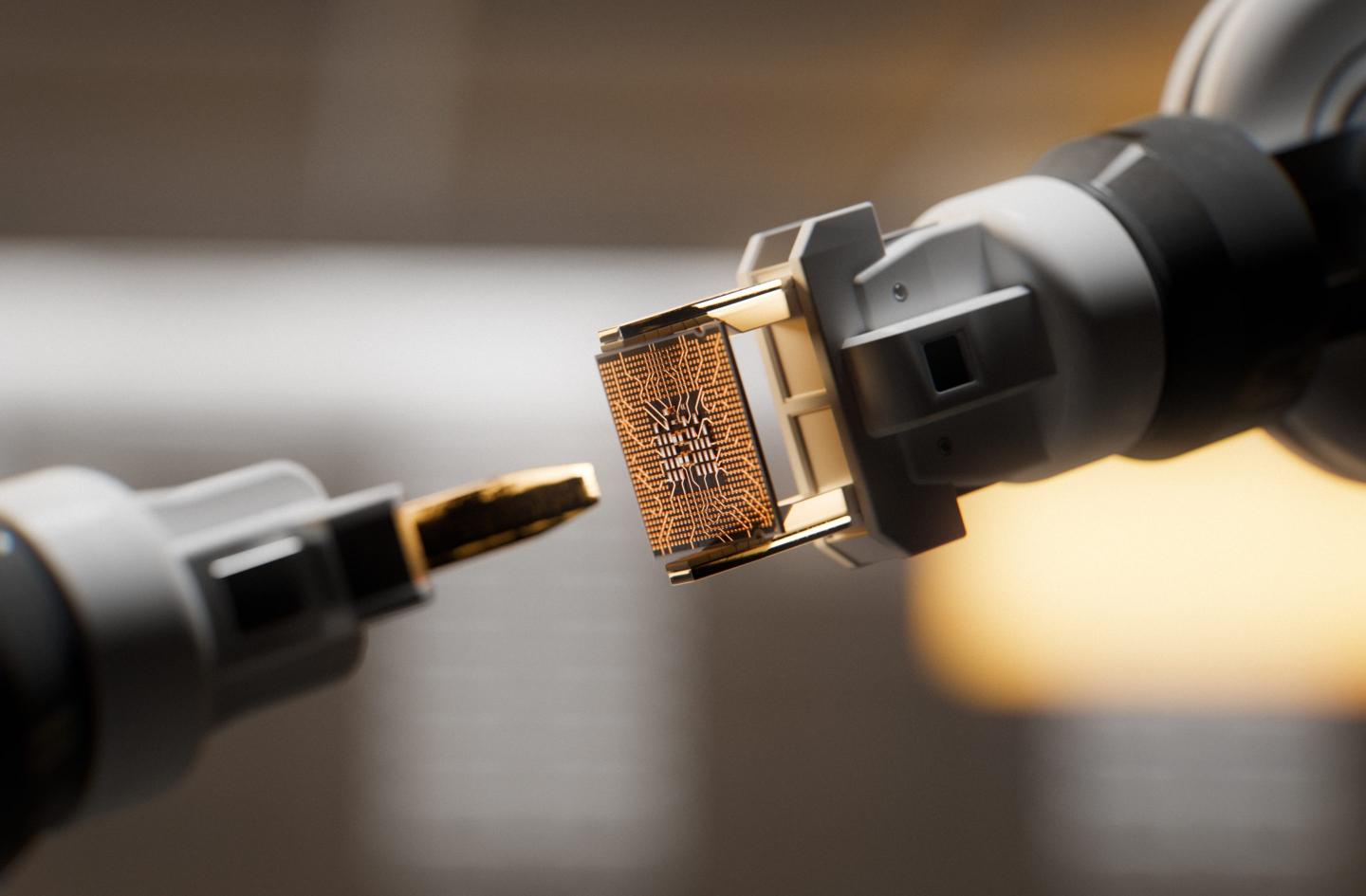 Rbotic arm is gripping a CPU inside of a circuit board factory.