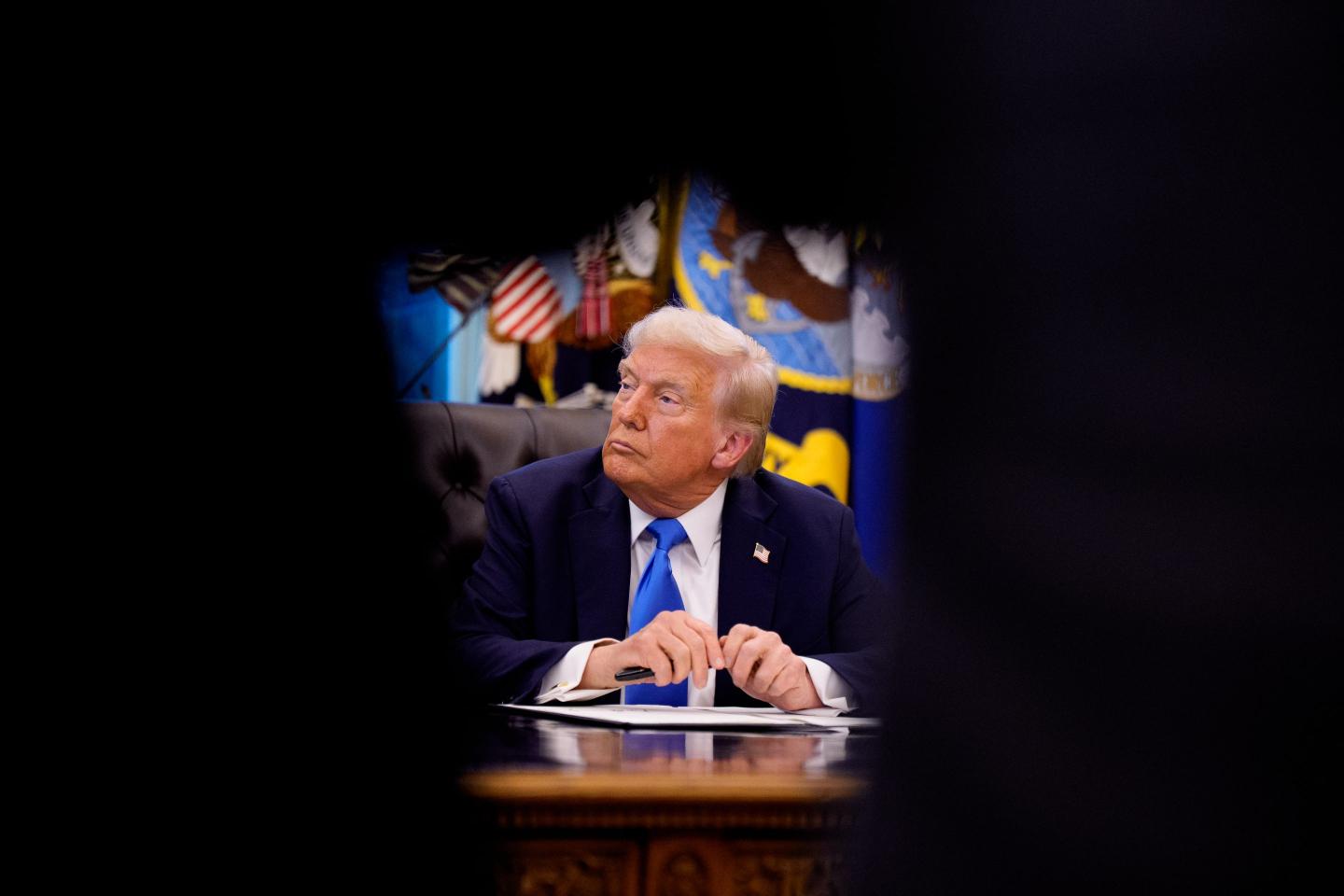 President Donald Trump signing an executive order introducing a $100,000 fee for H-1B visas.