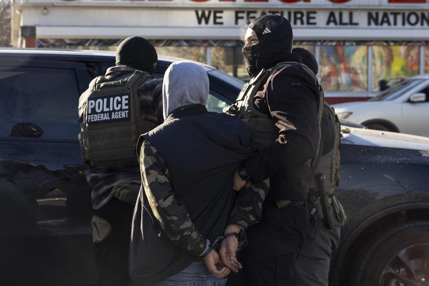 A federal agent arrest a man after questioning him in the street in Minneapolis, Minneapolis, MN, U.S., January 14, 2026