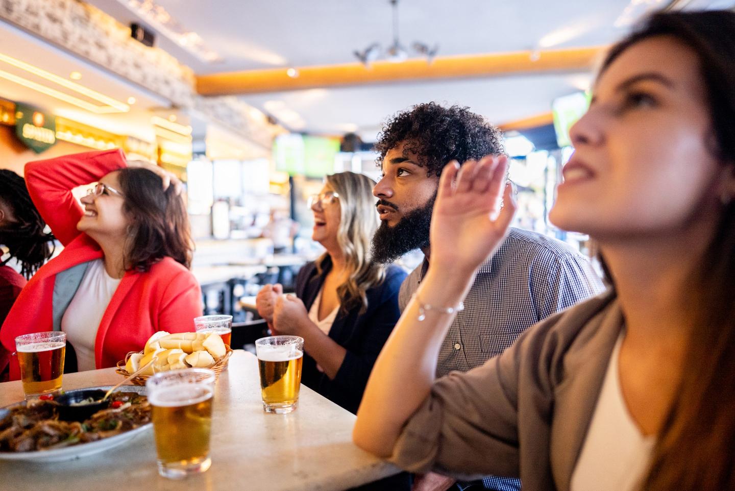 Coworkers watching World Cup at a bar