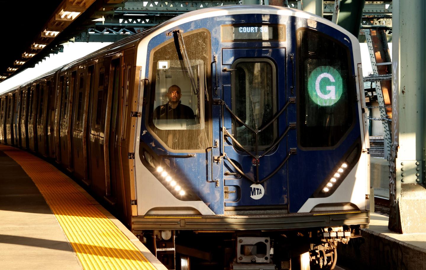 A G New York subway train at a stop