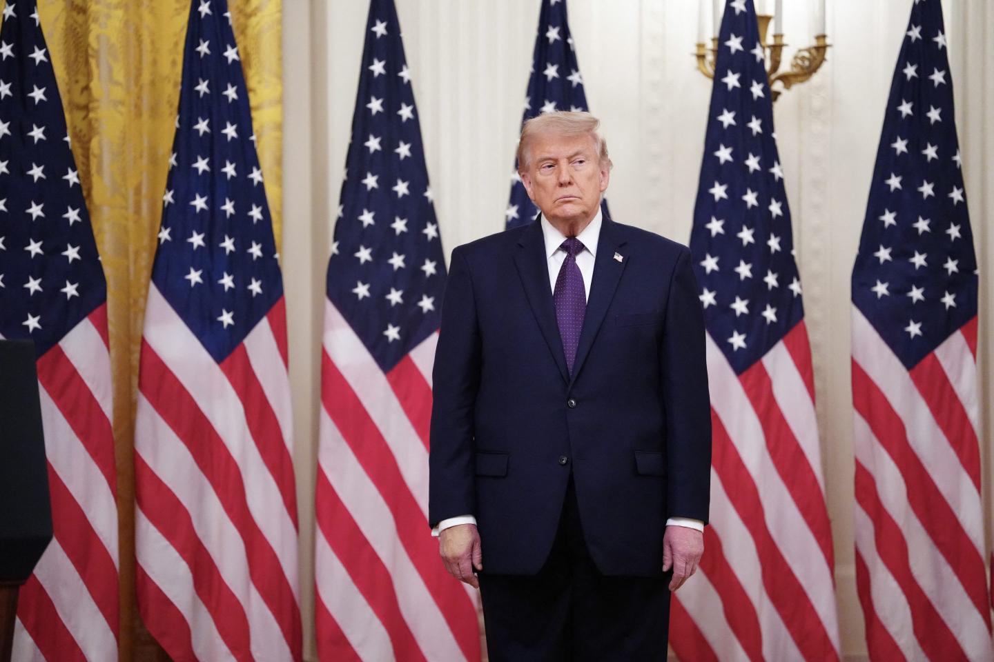 US President Donald Trump looks on during a swearing in ceremony for new Chairman of the Federal Reserve Kevin Warsh in the East Room of the White House in Washington, DC on May 22, 2026.