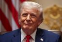 Donald Trump smirks and tilts his head slightly to the side.
