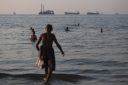 Vessels lie at anchor in the Strait of Hormuz off Iran's coast.