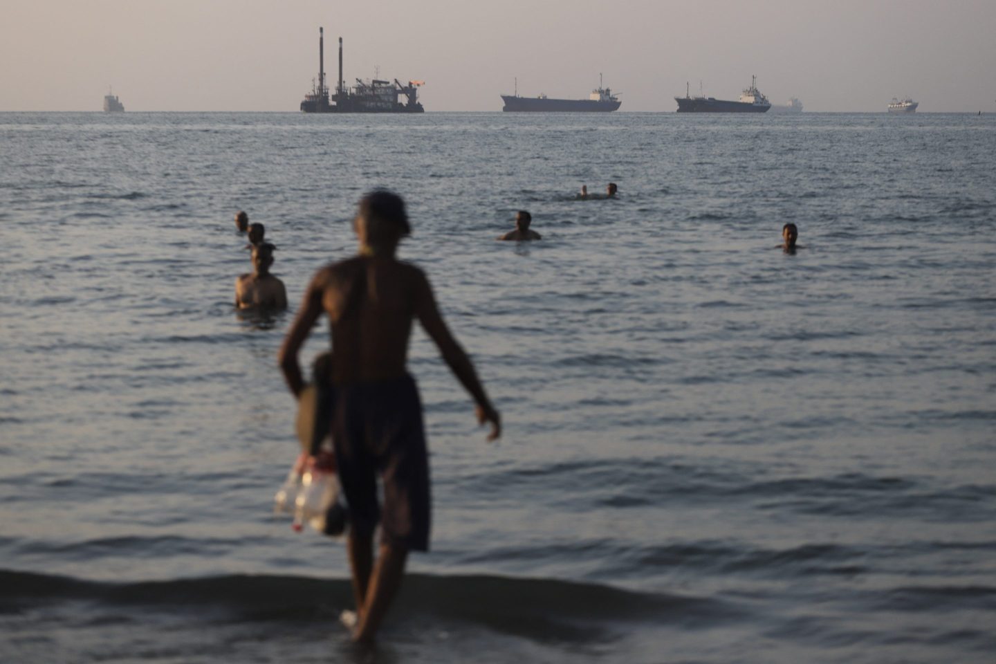 Vessels lie at anchor in the Strait of Hormuz off Iran's coast.