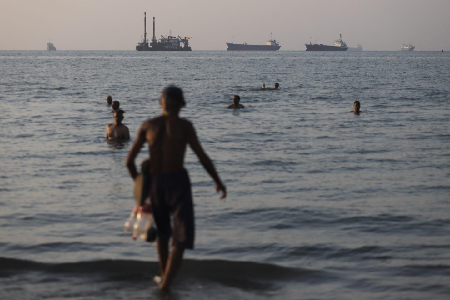 Vessels lie at anchor in the Strait of Hormuz off Iran's coast.