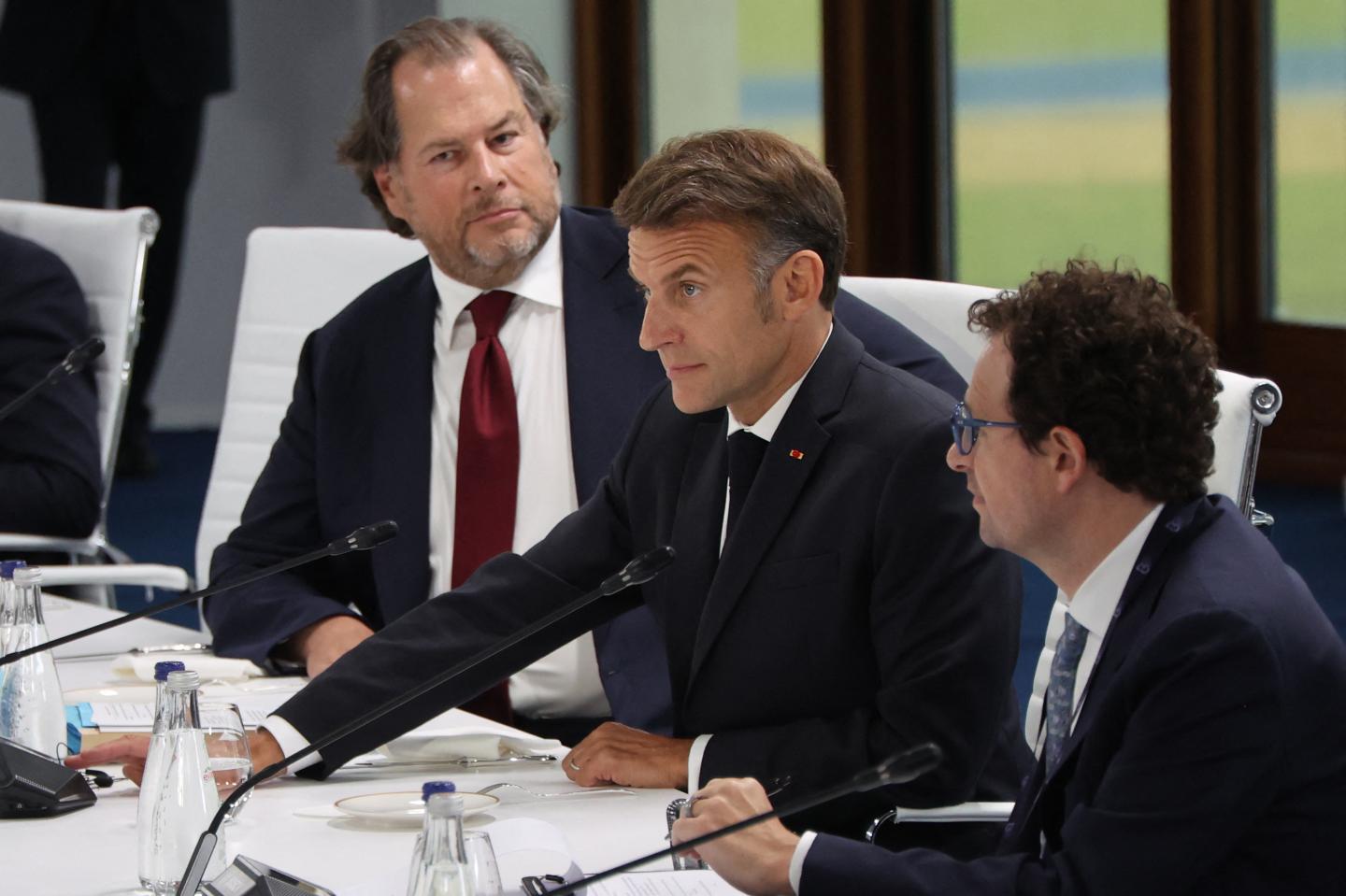 France's President Emmanuel Macron (center) with Salesforce CEO Marc Benioff (left) and Anthropic CEO Dario Amodei (right) at a working lunch meeting at the G7 summit in Evian, France, on June 17, 2026.(Photo: Ludovic Marin/AFP/Getty Images)