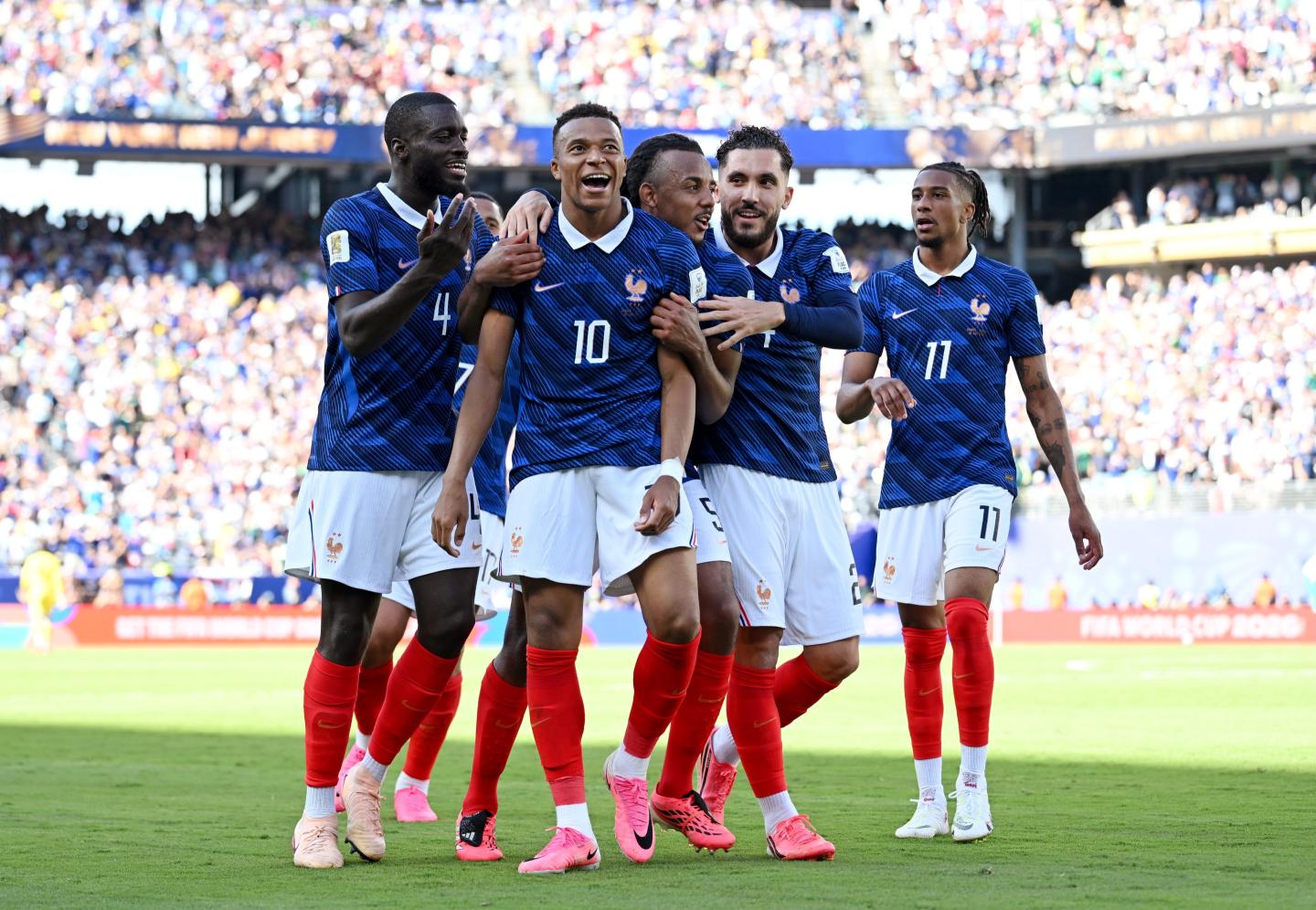 Kylian Mbappe #10 of France celebrates with teammates