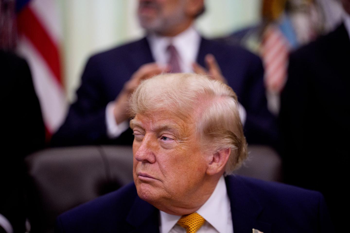 U.S. President Donald Trump winks during an executive order signing event in the Oval Office of the White House on June 22, 2026 in Washington, DC.
