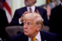 U.S. President Donald Trump winks during an executive order signing event in the Oval Office of the White House on June 22, 2026 in Washington, DC.
