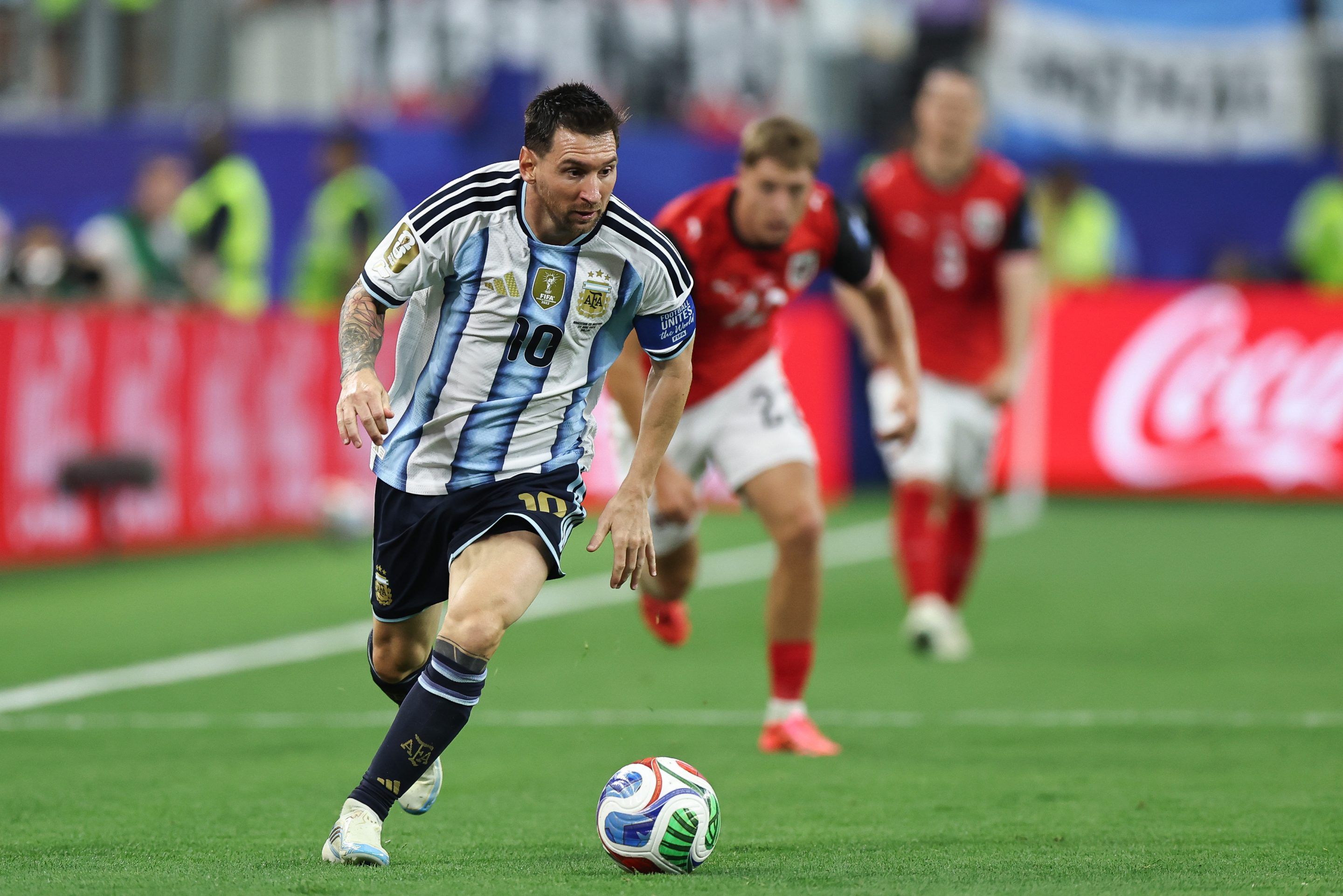 Argentina's Lionel Messi drives the ball forward during a match against Austria.