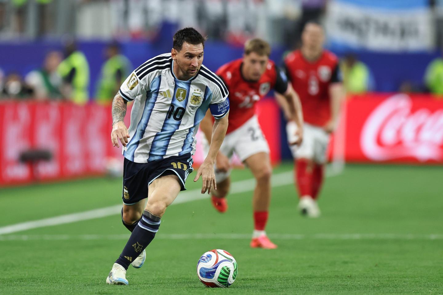 Argentina's Lionel Messi drives the ball forward during a match against Austria.