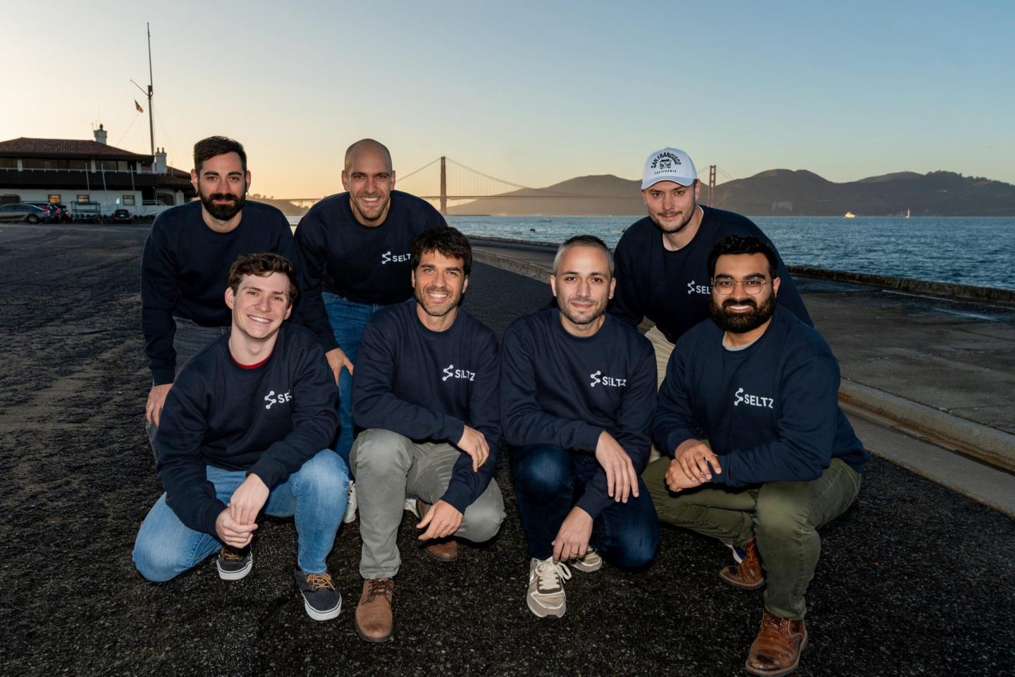 The founding team at Seltz, a startup trying to reinvent web search for AI agents, pose for a group photo with San Francisco's Golden Gate Bridge in the background.