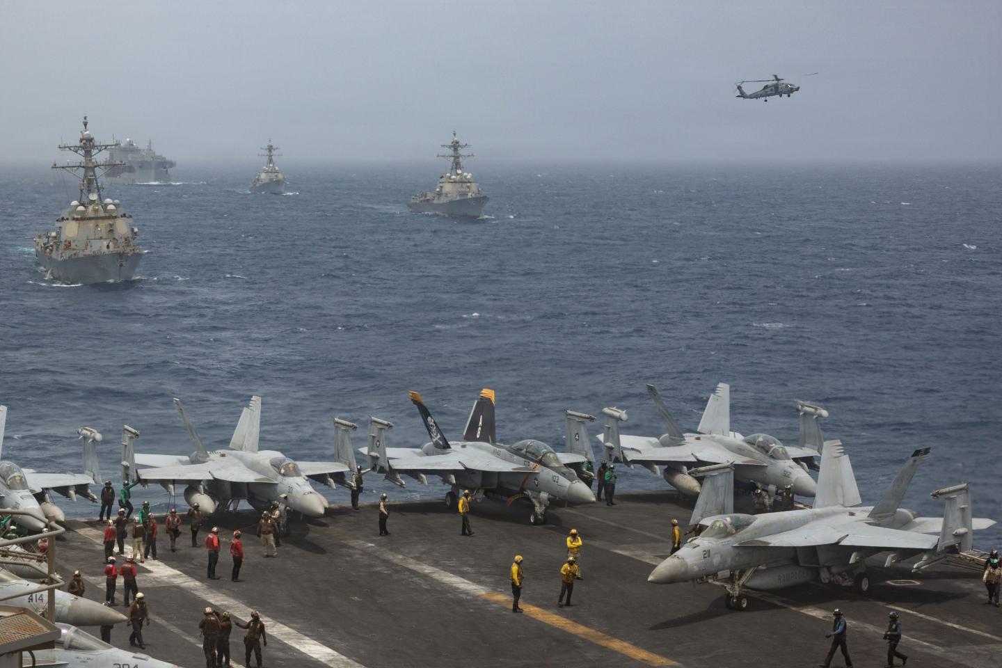 U.S. Navy warships and aircraft transit the Arabian Sea in close formation as CENTCOM forces continue to promote regional security and stability, June 30, 2026. 