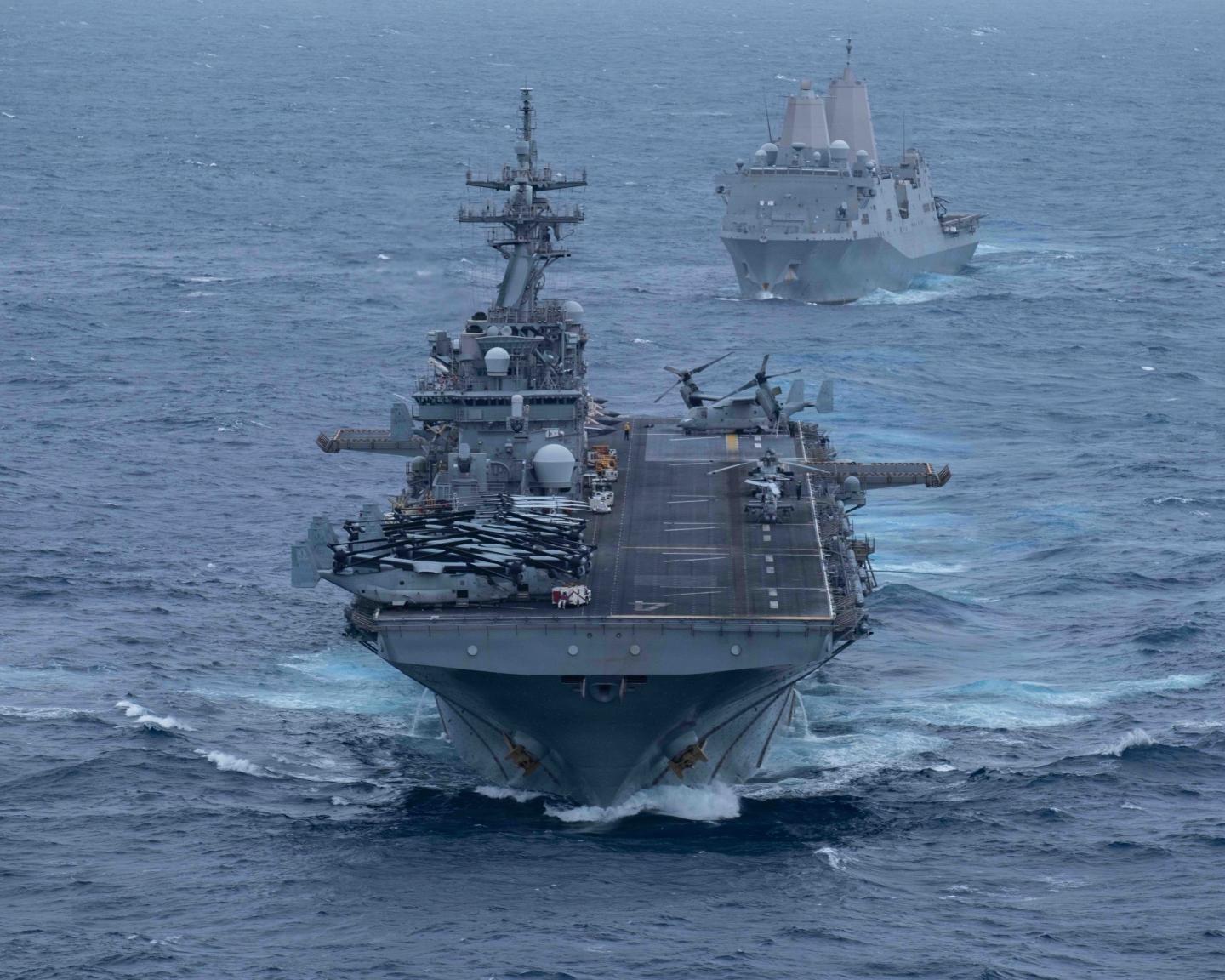 Wasp-class amphibious assault ship USS Boxer (LHD 4), front, and San Antonio-class amphibious transport dock ship USS Portland (LPD-27), sail in formation in the U.S. Central Command area of responsibility, June 30, 2026.