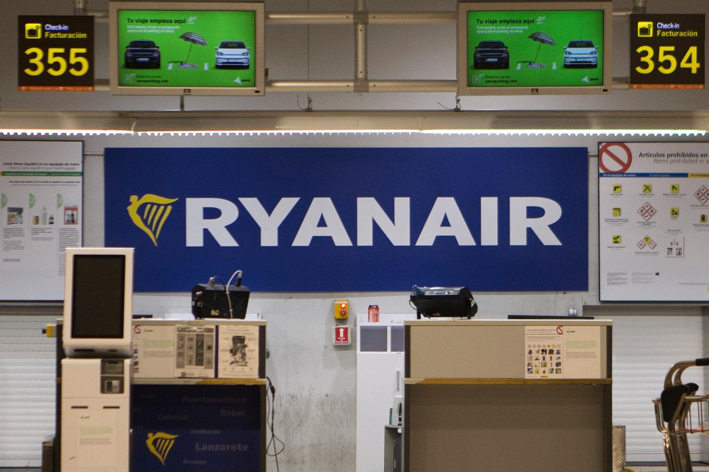 A man was partly sucked out of a broken window on a Ryanair plane shortly after takeoff, but fellow passengers pulled him back