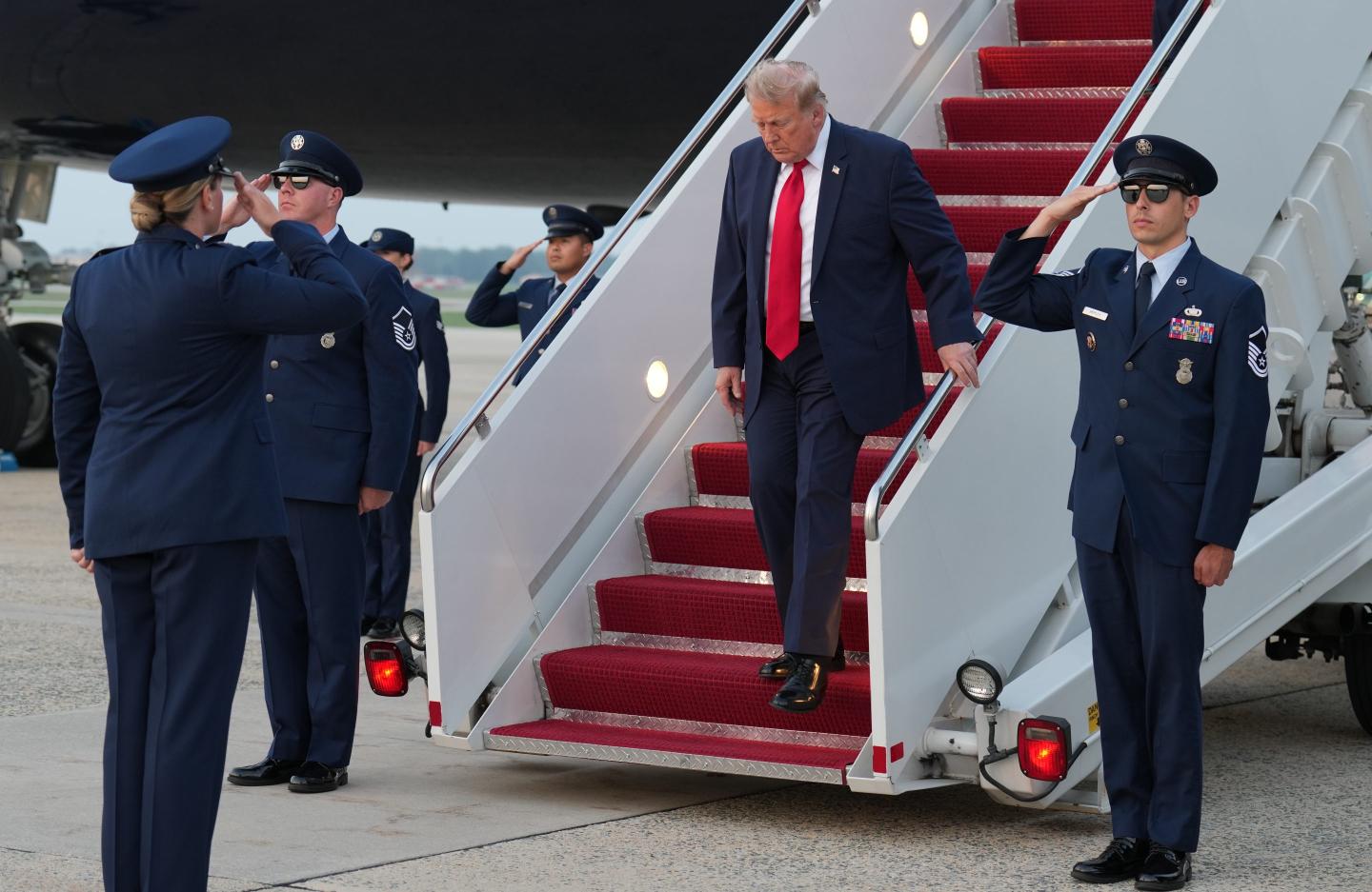 President Donald Trump walks down the steps from Air Force One.