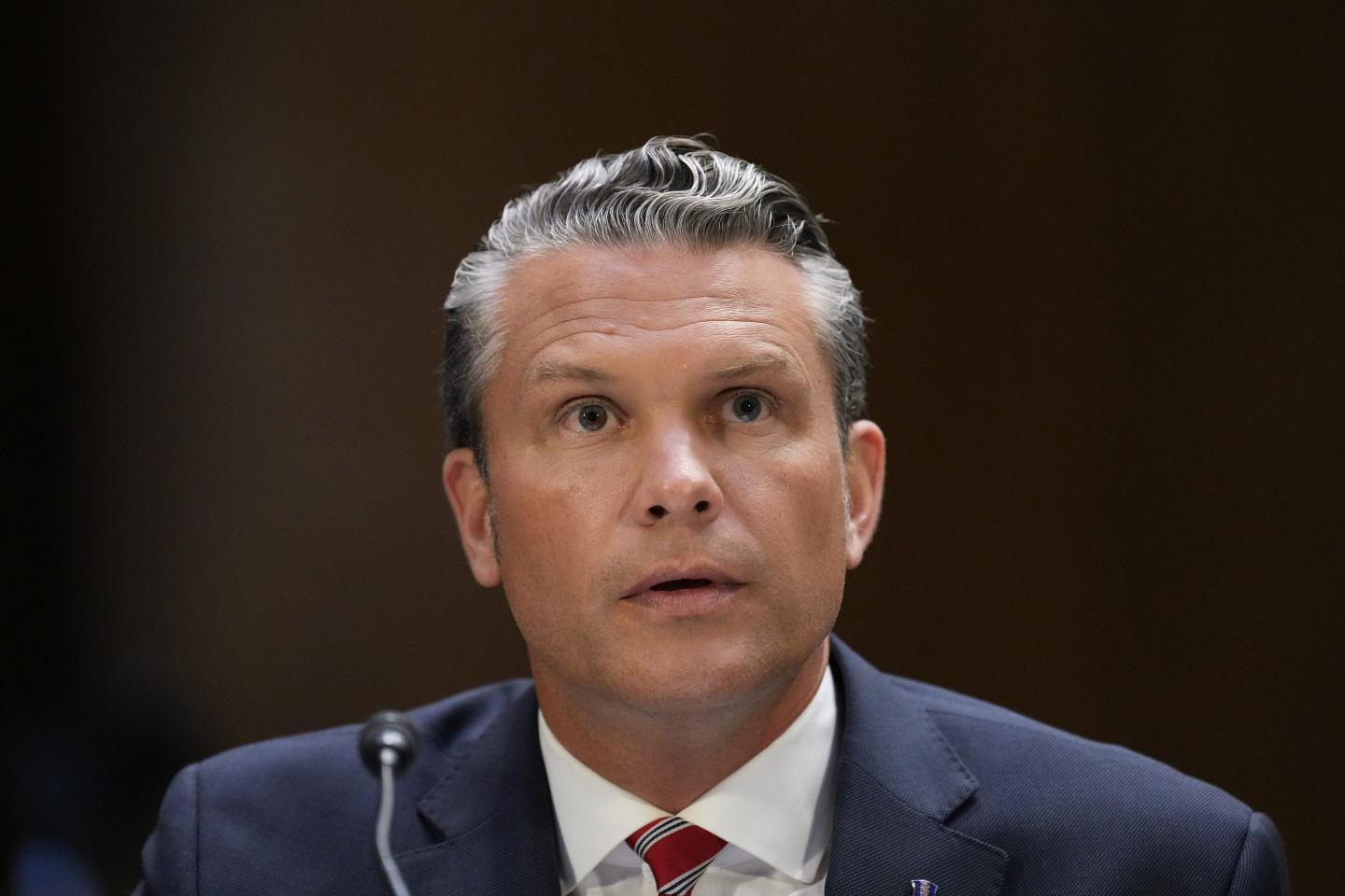 Defense Secretary Pete Hegseth sits and speaks at a Senate Committee Hearing