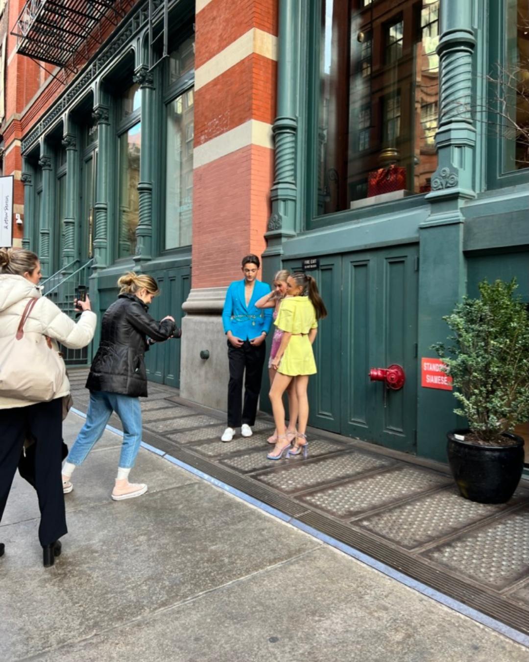 Photographers taking picture of models on the street in New York City
