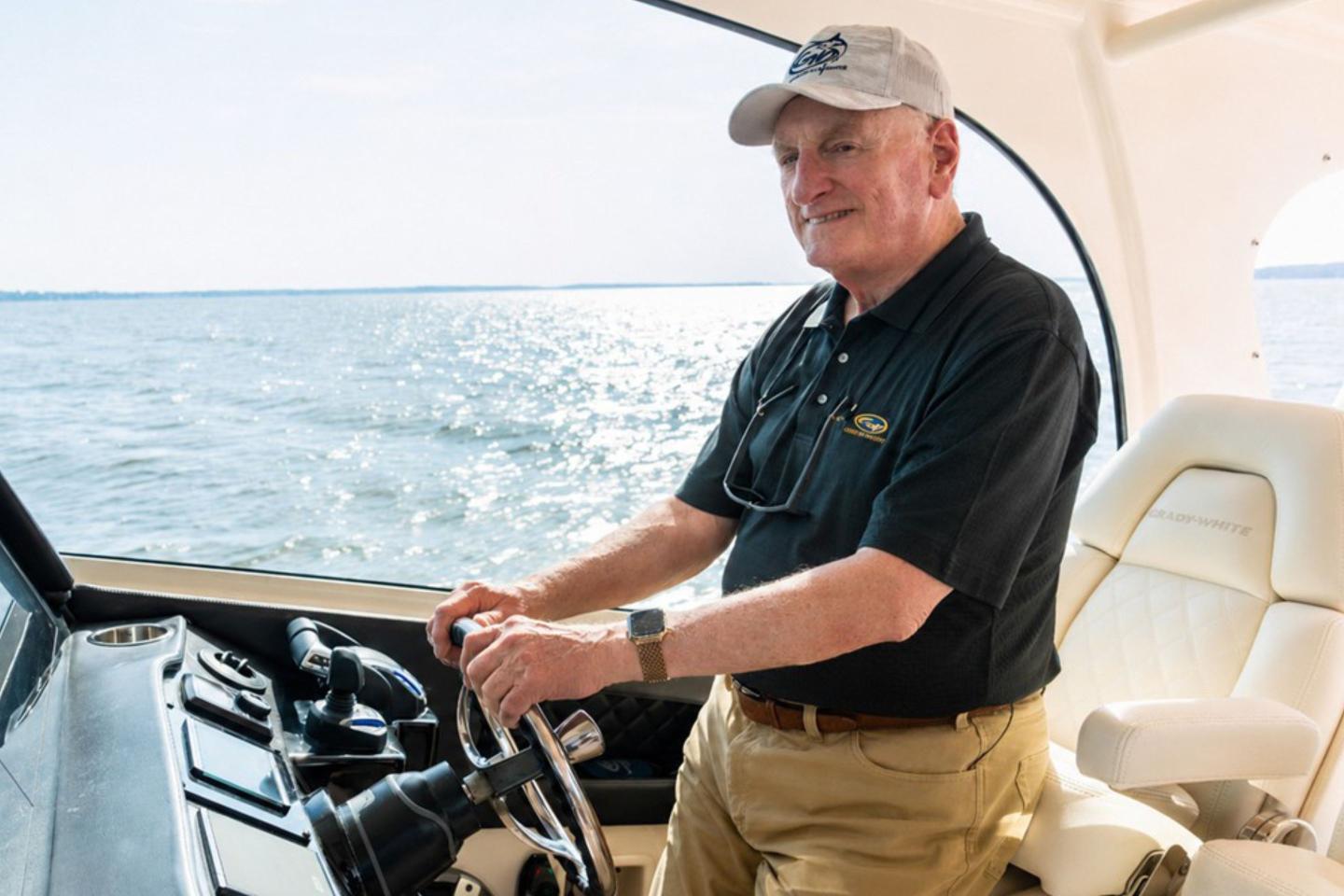 Eddie Smith Jr driving a boat