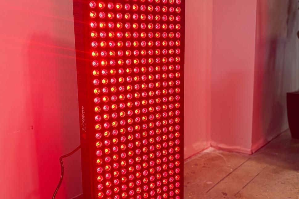 The Sun Home Medical-Grade Full Body Red Light fully lit up and glowing red