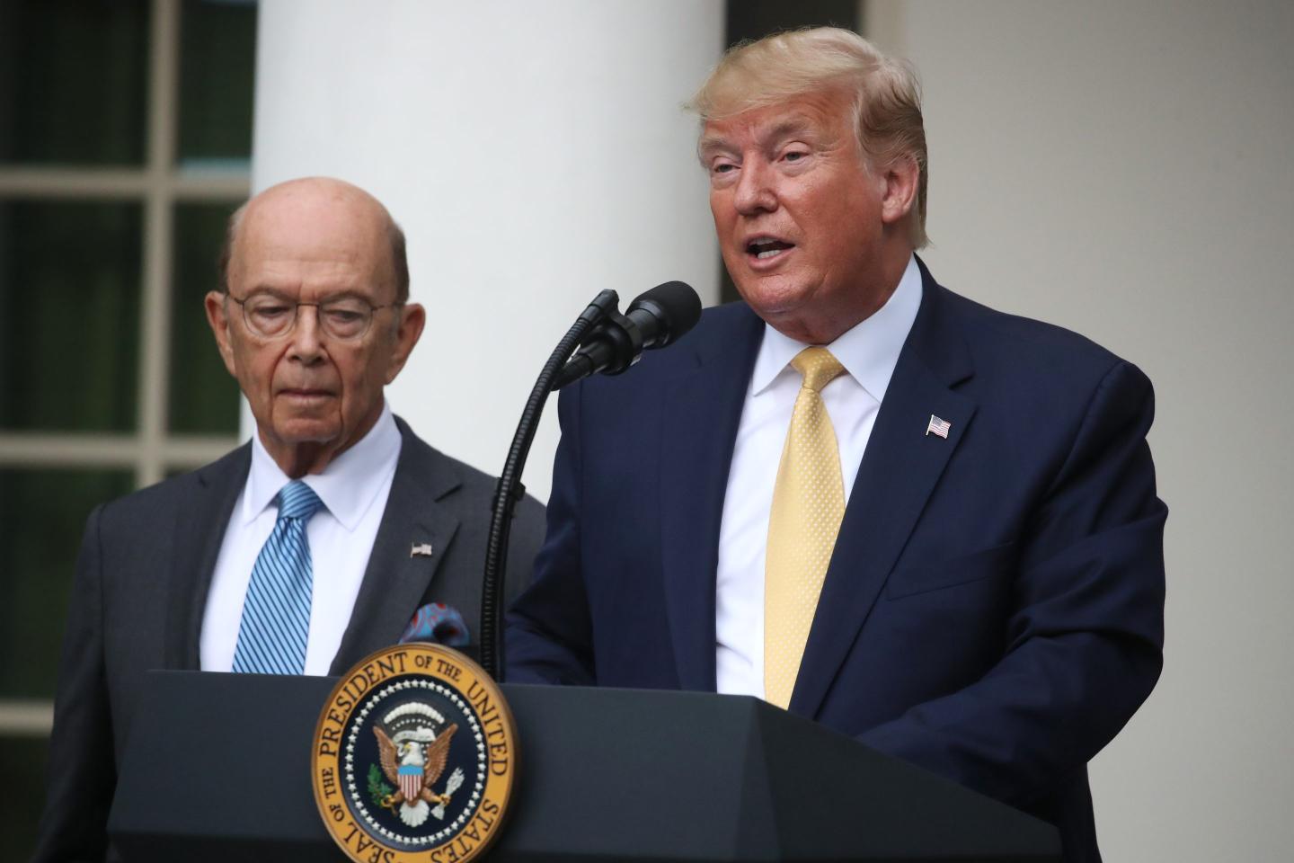 President Donald Trump makes a statement on the census with Secretary of Commerce Wilbur Ross (L) in the Rose Garden of the White House on July 11, 2019 in Washington, DC.
