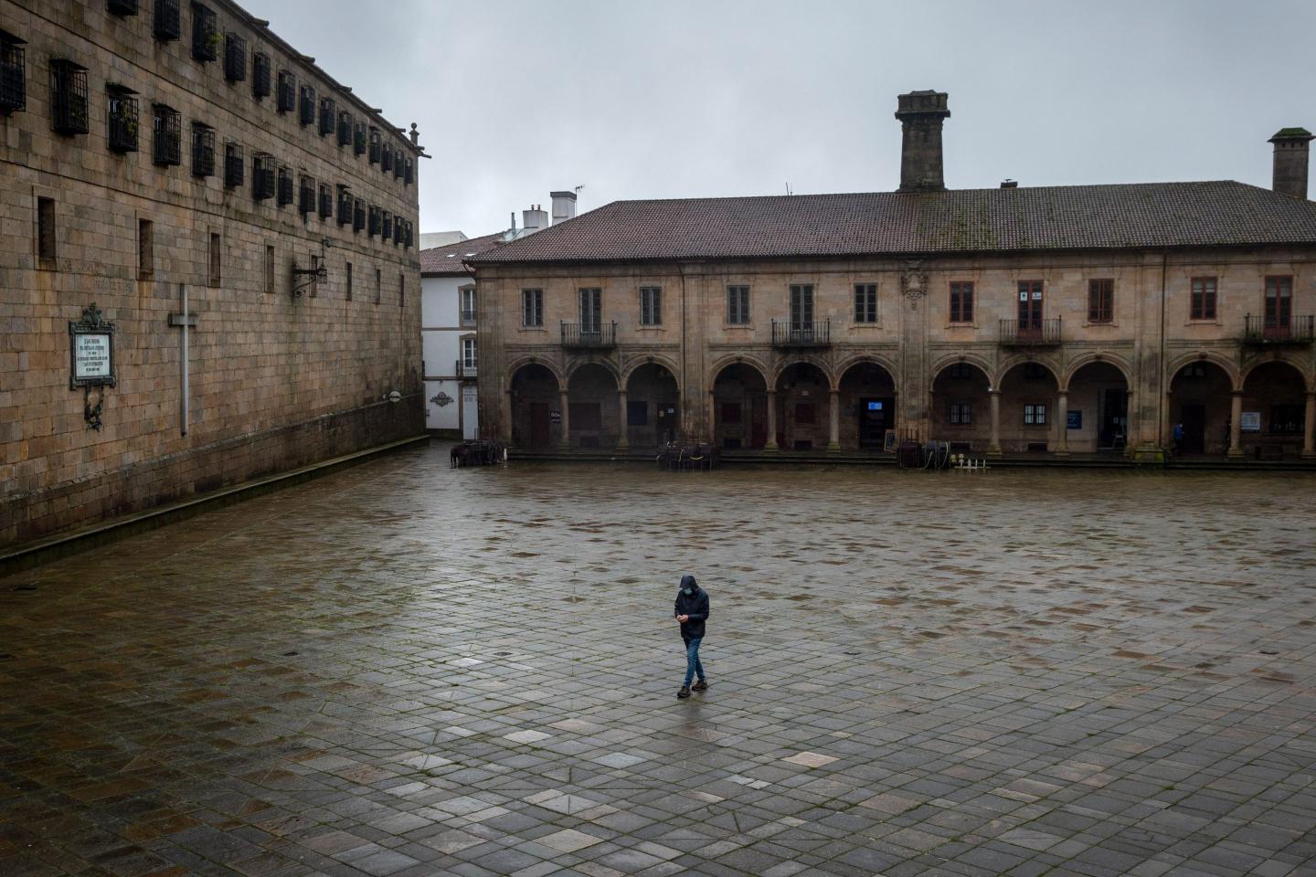 A person walks alone in a public plaza