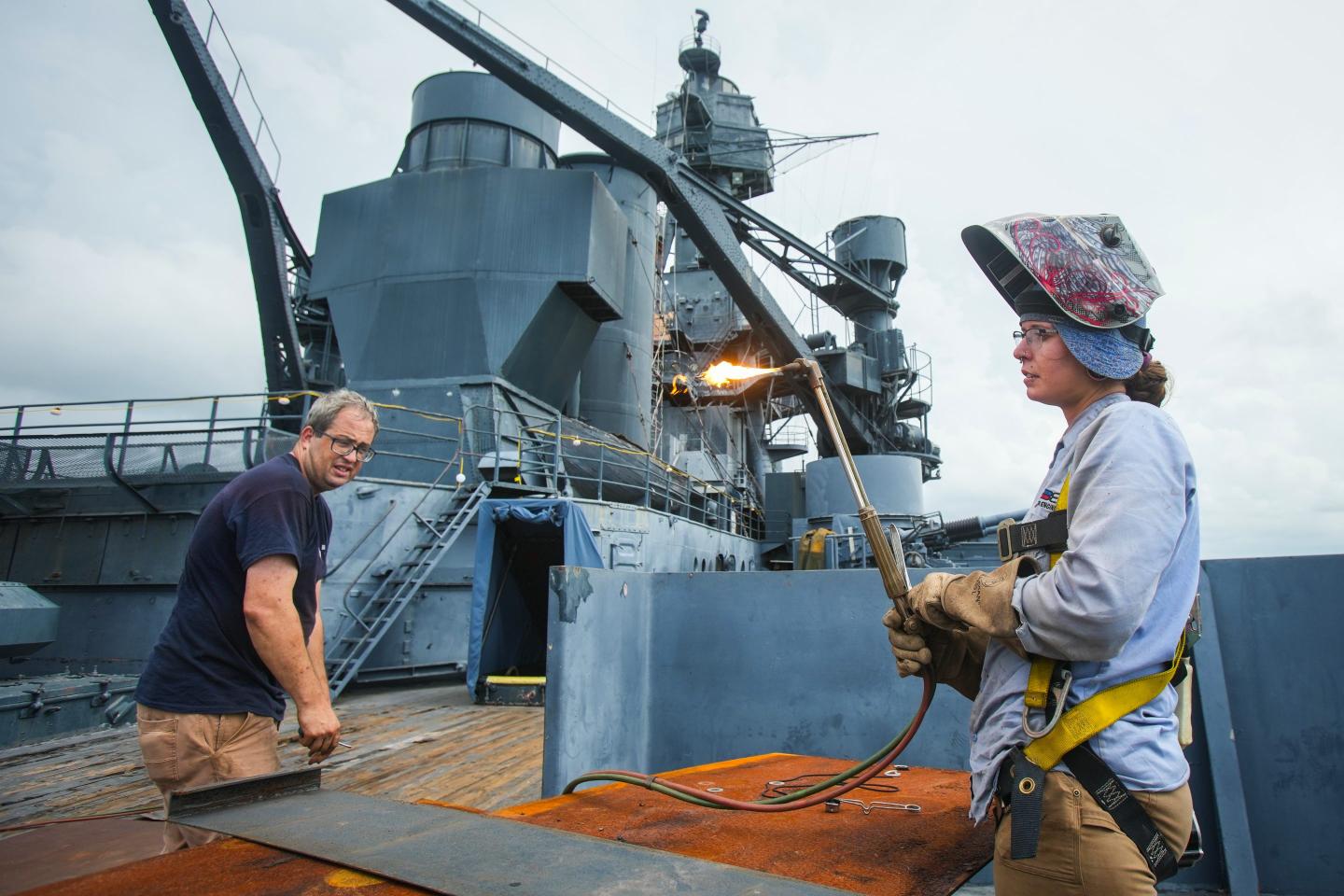 Welder on a navy boat