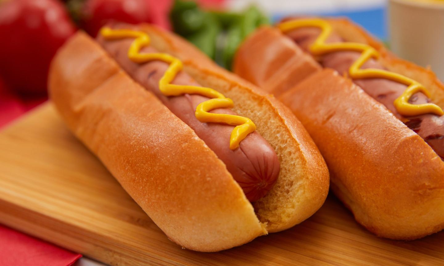 Americans will eat 150 million hot dogs today. One specific American is predicted to eat 70 of them