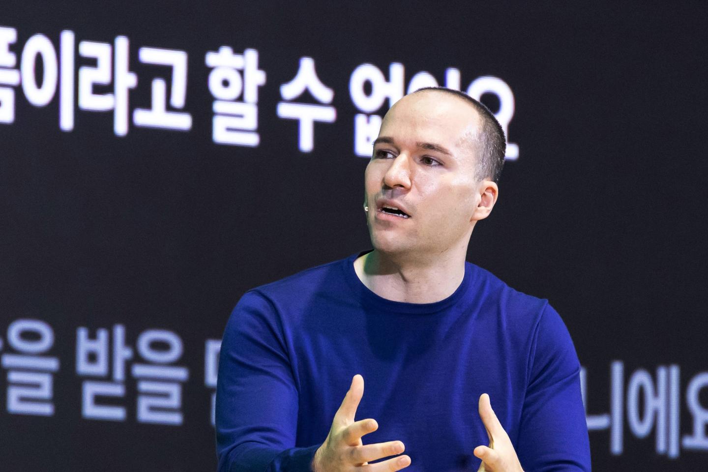 brockman speaks on stage