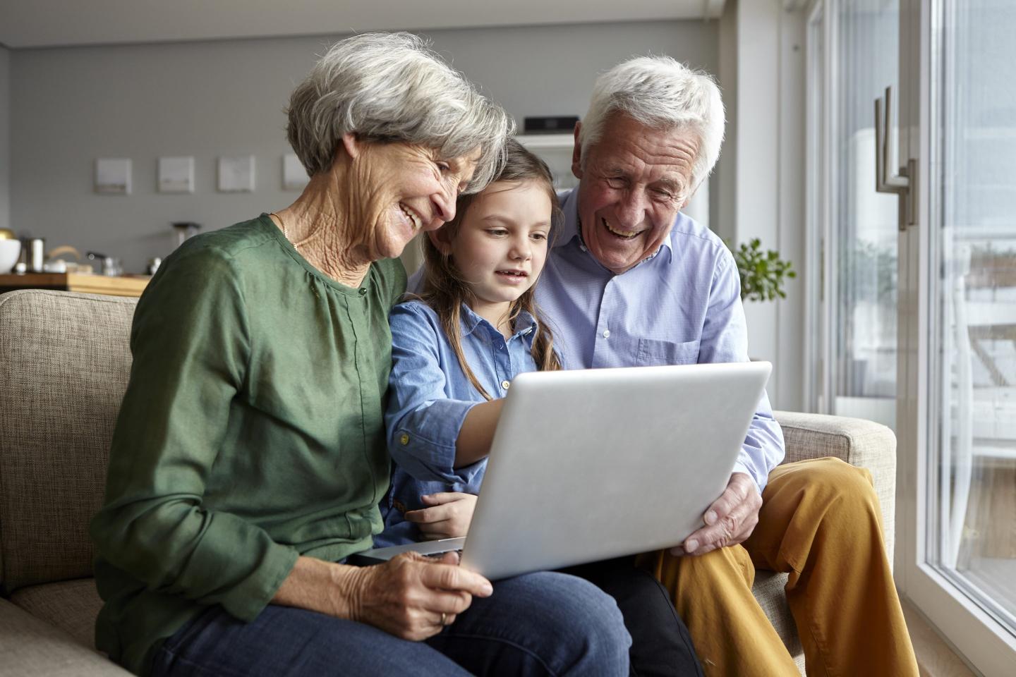 grandparents grandkid on a tablet