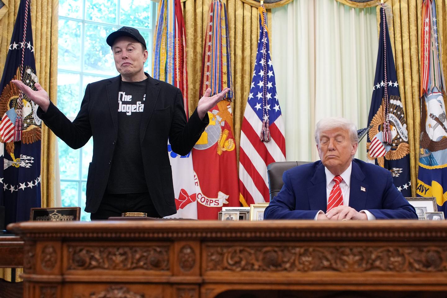 Elon Musk and President Donald Trump seated