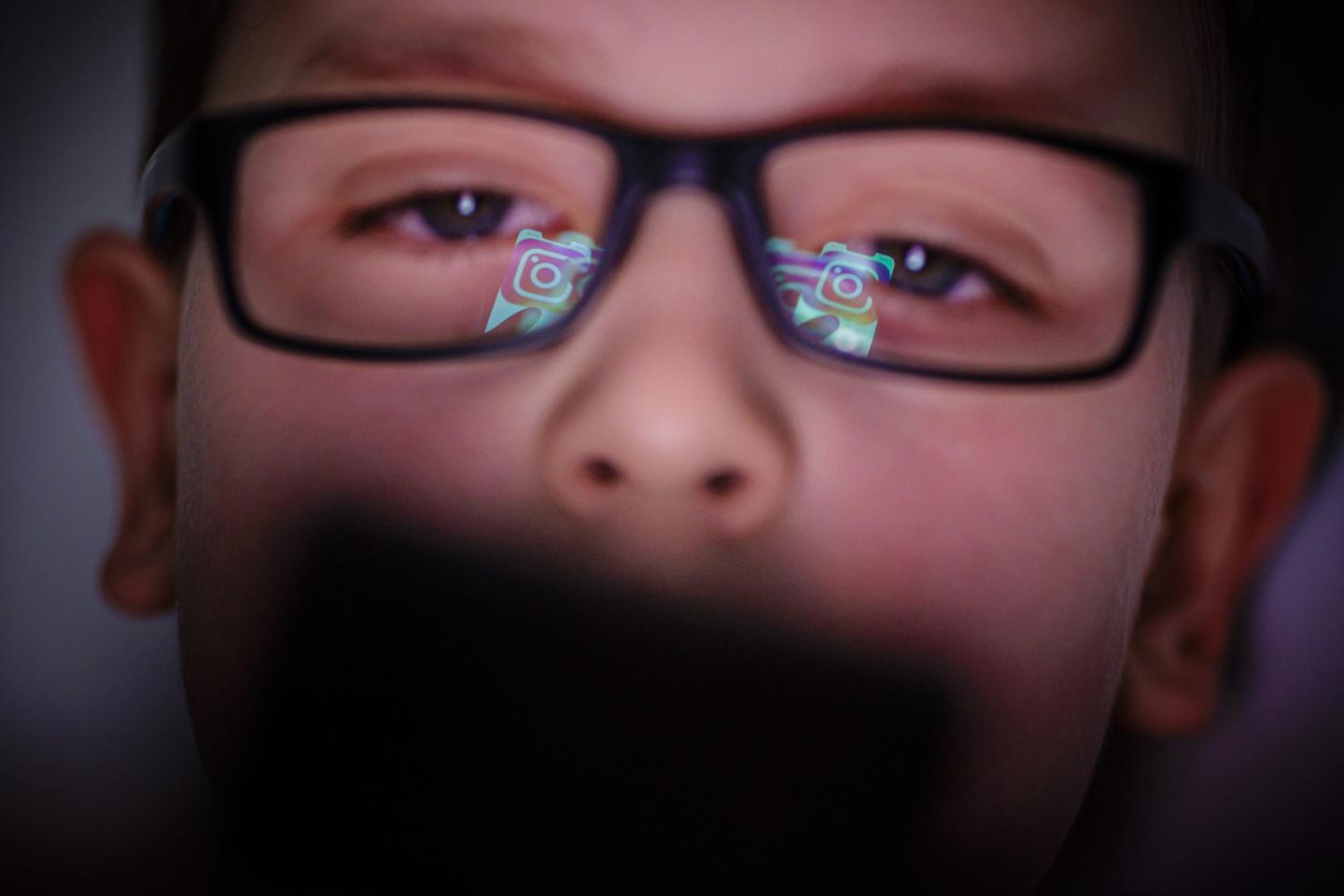 Kid watching social media