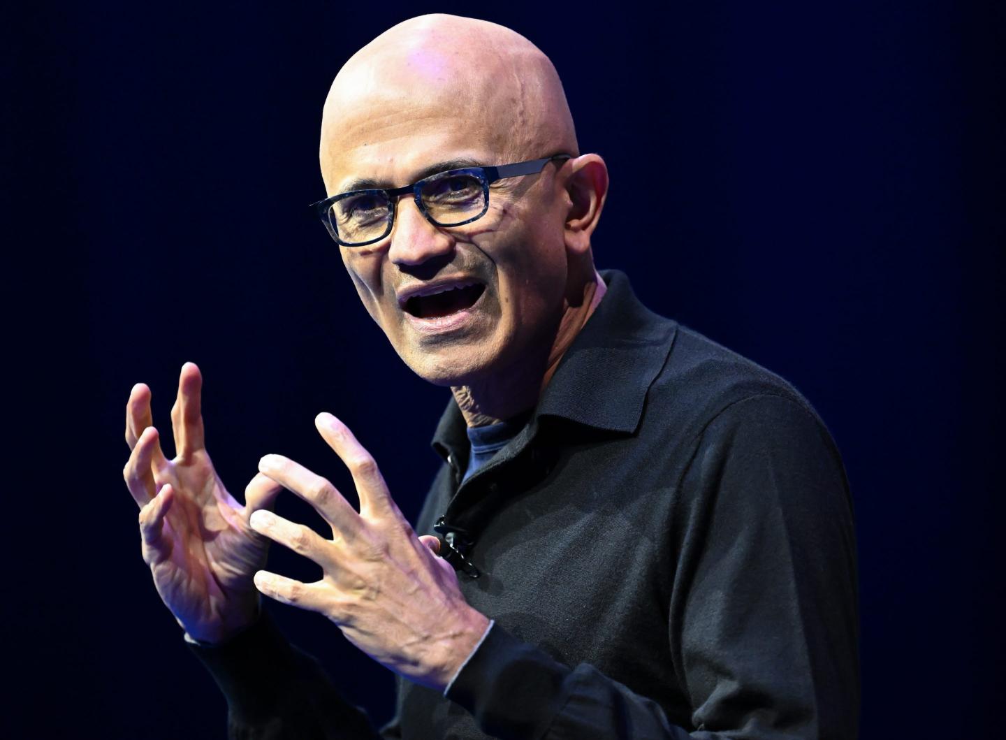 Man in glasses gesturing