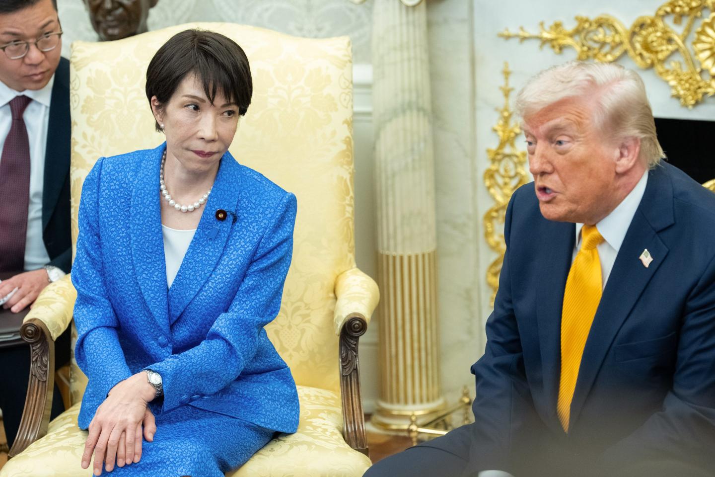 Japanese Prime Minister Sanae Takaichi and U.S. President Donald Trump sit in the Oval Office.