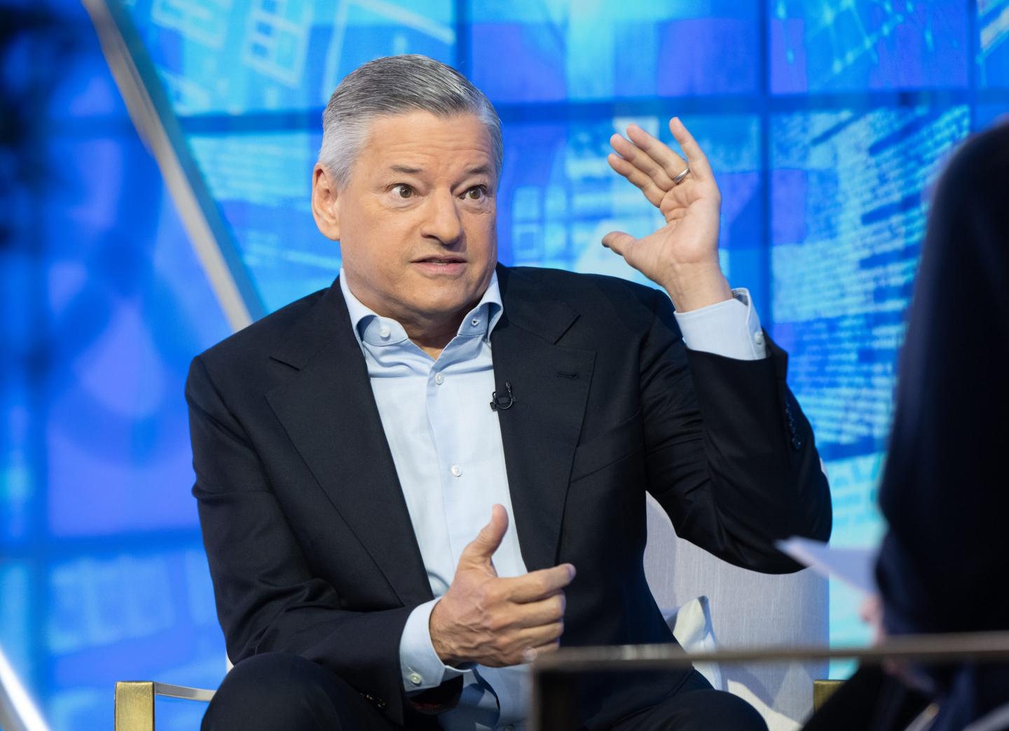 Man in suit gesturing