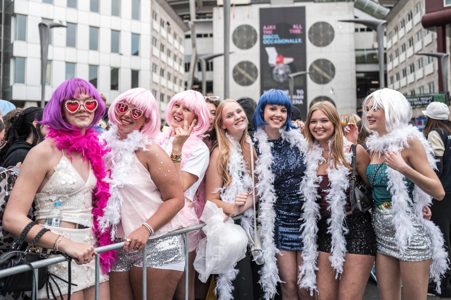 Concert-goers and fans of British singer Harry Styles await outside the Johan Cruijff ArenA