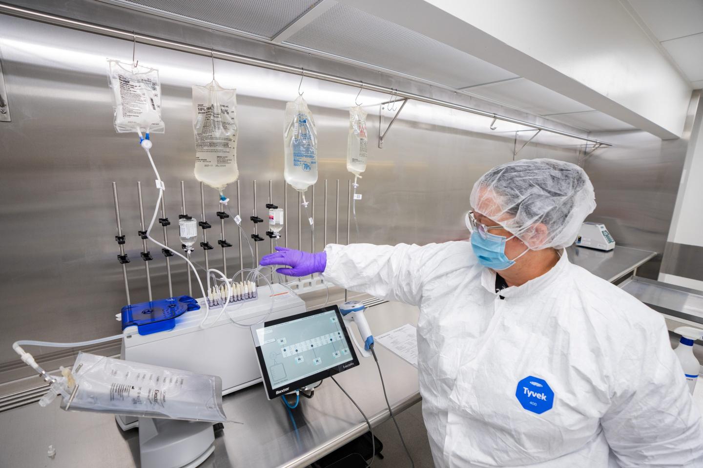 Pharmacy technician Brandy Leroy fills a TPN bag using the ExactaMix Pro Automated Compounding System