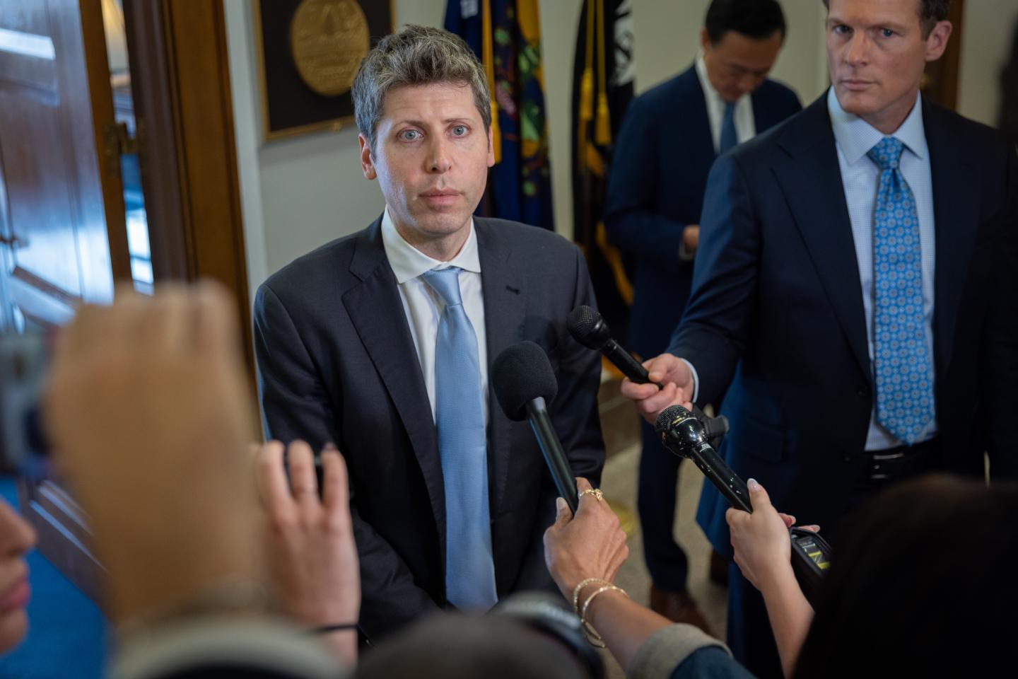 Sam Altman speaking to reporters.