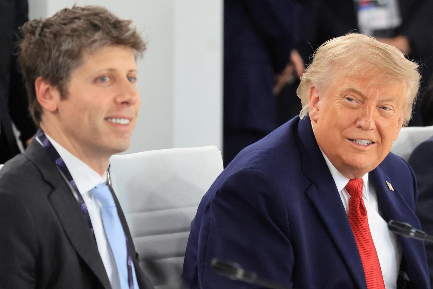 OpenAI CEO Sam Altman sitting next to U.S. President Donald Trump at the G7 Meeting in Evian, France.