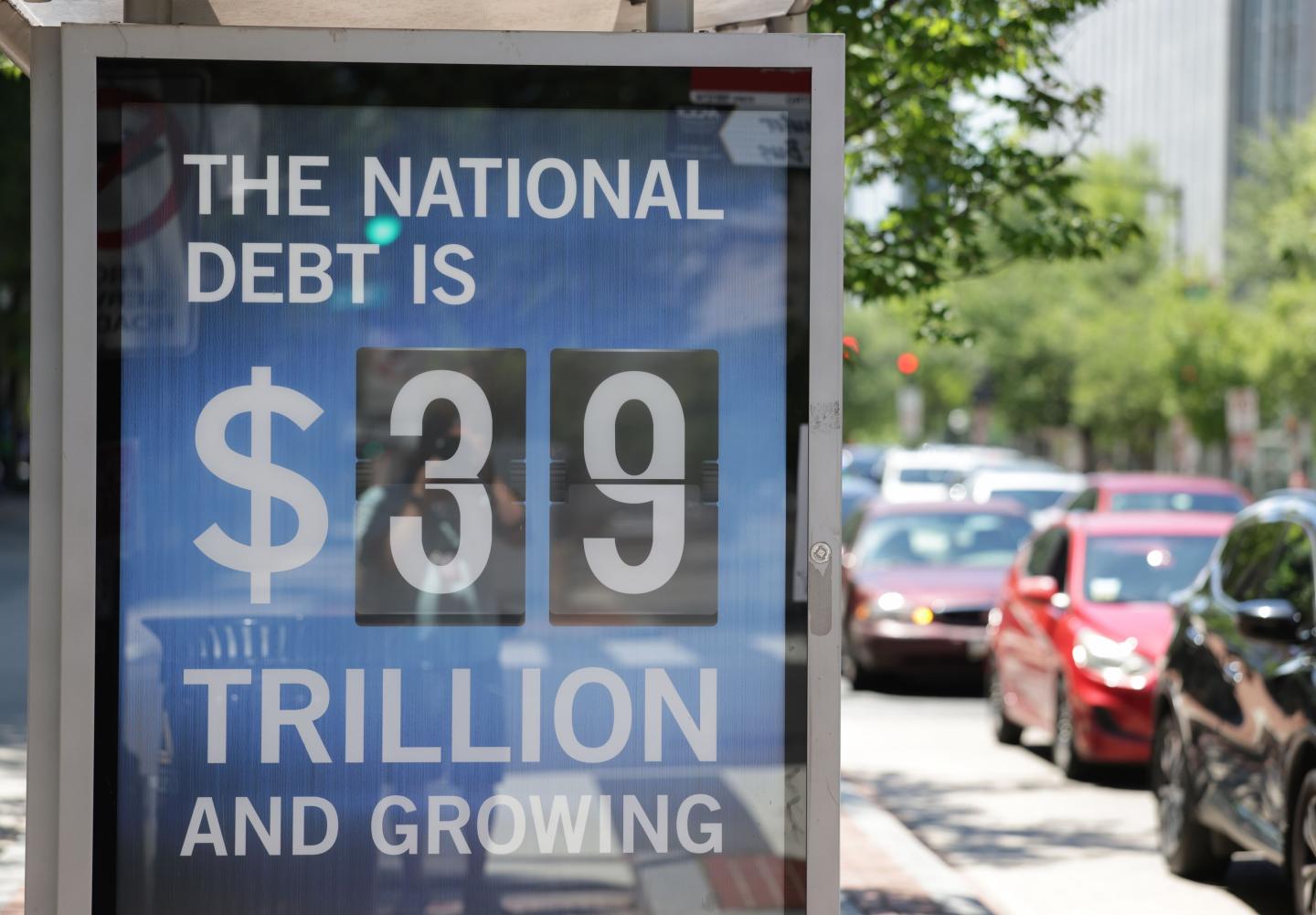 A Peterson Foundation bus stop sign displays the national debt on June 12, 2026 in Washington, DC.