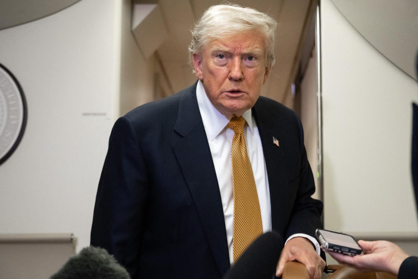 President Donald Trump speaks with the media aboard Air Force One shortly after departure from Mildenhall Air Force Base in the United Kingdom, on July 8, 2026.