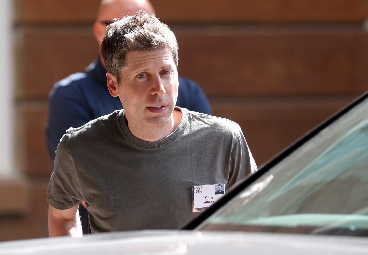 Sam Altman getting into a car