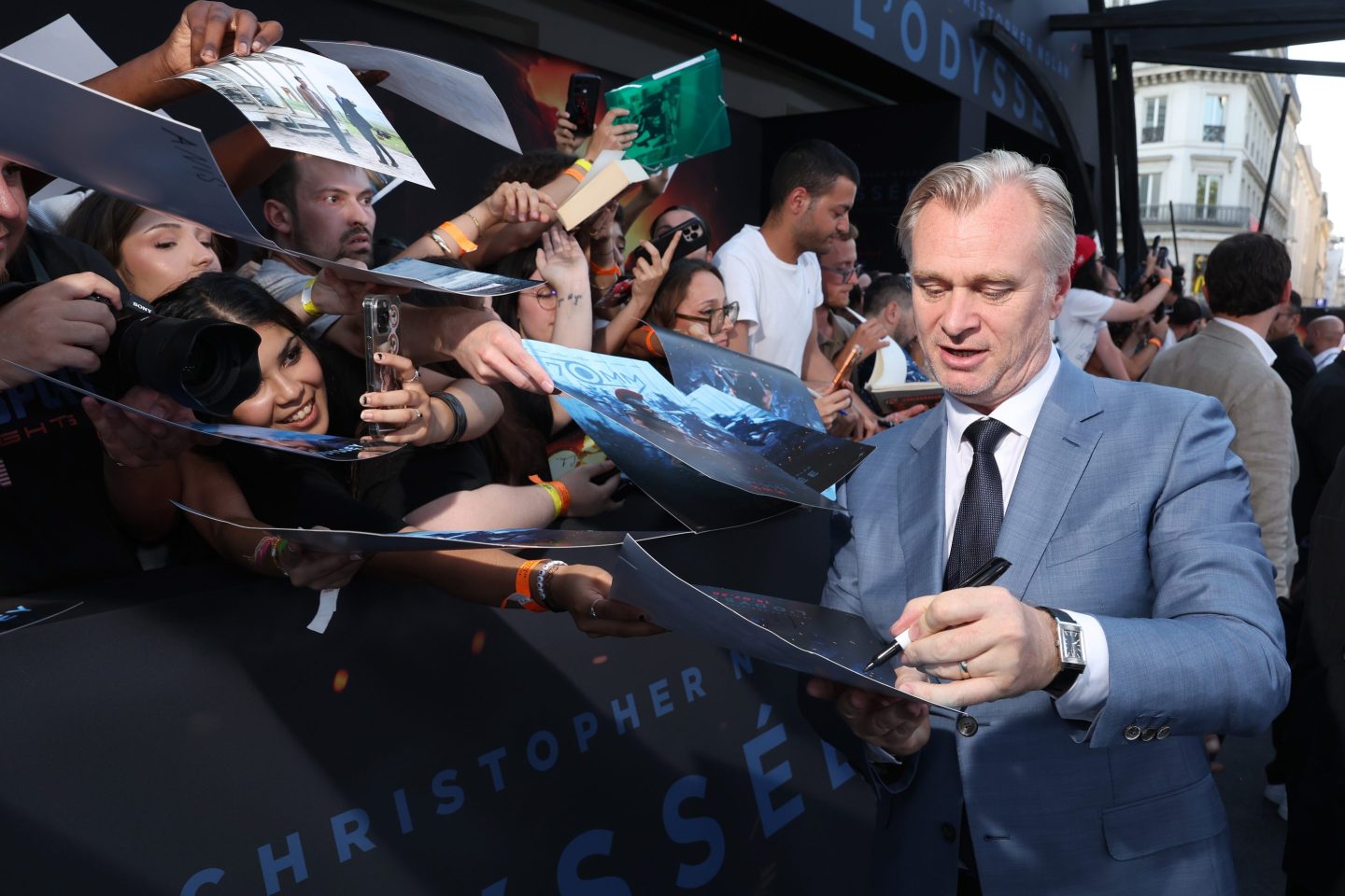 Christopher Nolan interacts with fans at Odyssey premier
