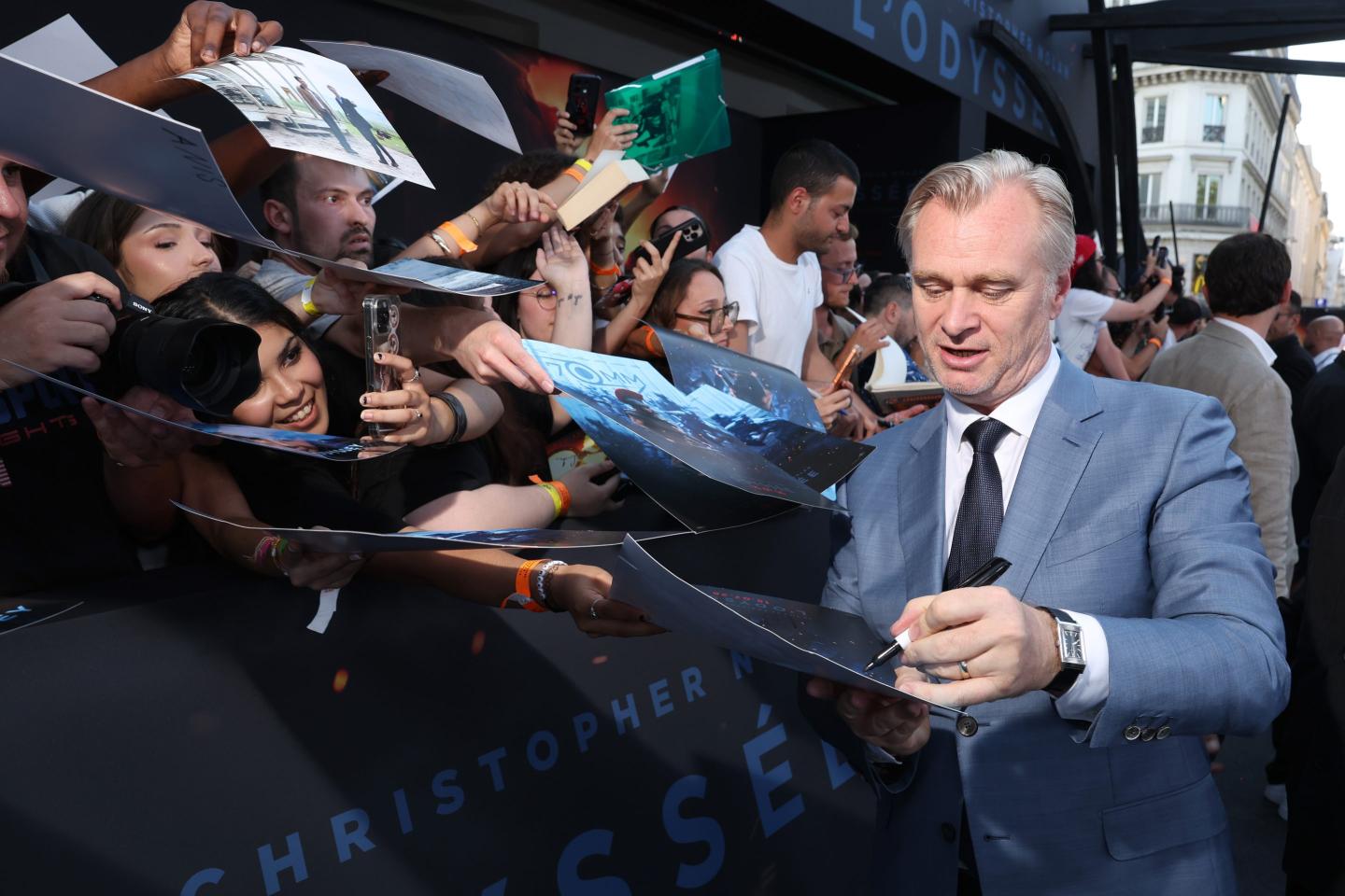 Christopher Nolan interacts with fans at Odyssey premier